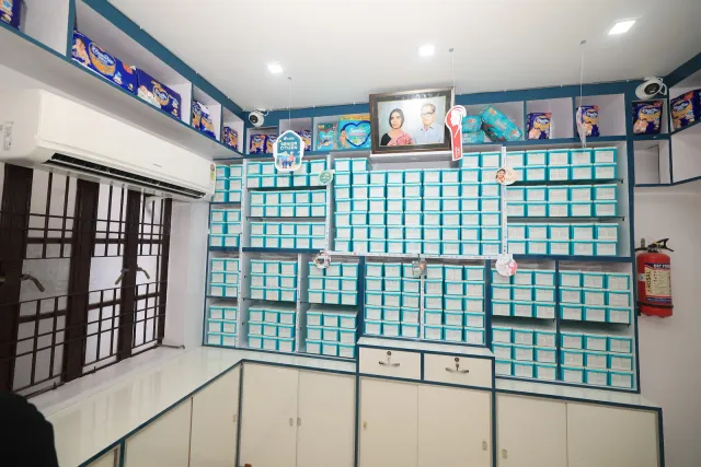 Neatly arranged aqua drawers bring order to the pharmacy interior. — Juran Chapra, Muzaffarpur