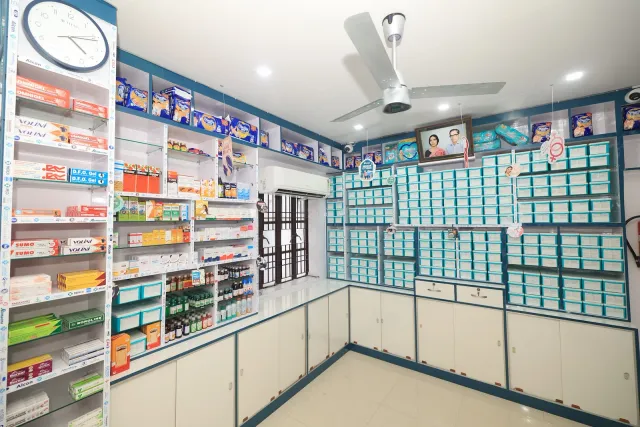 A wider view of the pharmacy's counters, shelves and aqua drawers. — Juran Chapra, Muzaffarpur