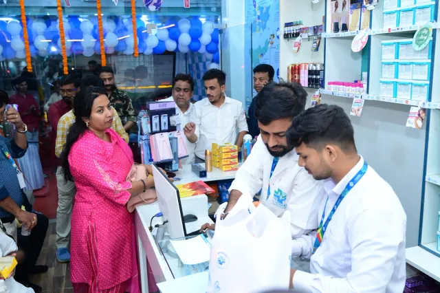 An opening-day moment at the pharmacy counter. — Gola Road