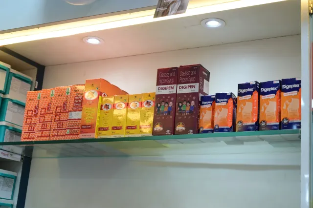 A closer view of products arranged along the pharmacy shelves. — Gola Road