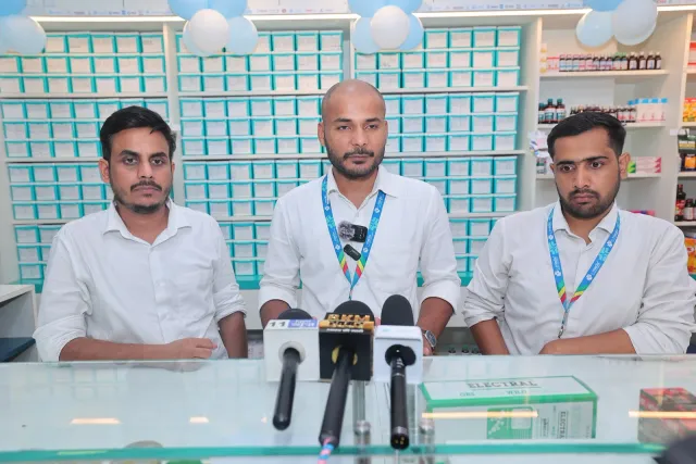The team shares a moment together in front of the media microphones. — Bikram