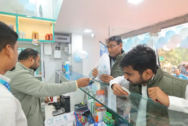 Guests pause for refreshments inside the pharmacy. — Muharram Chowk