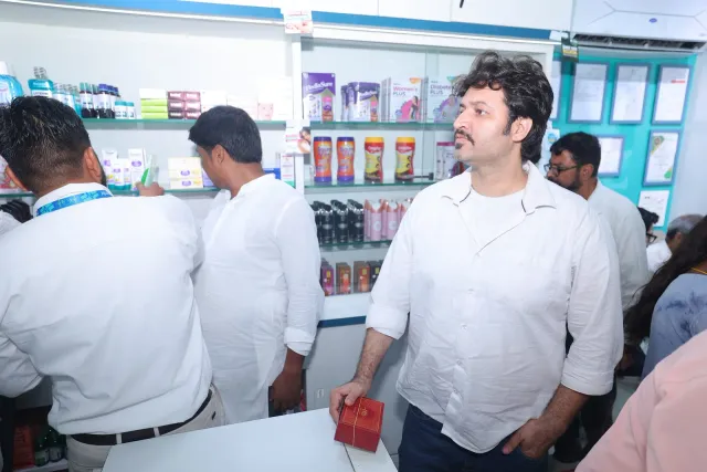 Teamwork and conversations continue behind the counter. — Sherghati