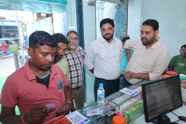 A candid look at people checking items around the pharmacy counter. — Sherghati