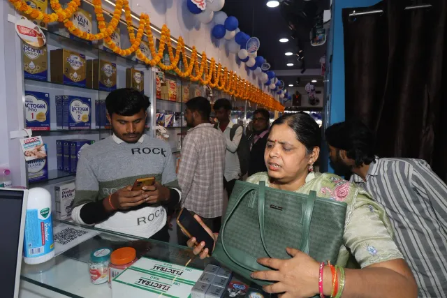 Computer work at the counter reveals the quieter side of the celebrations. — Mohanpur, Samastipur