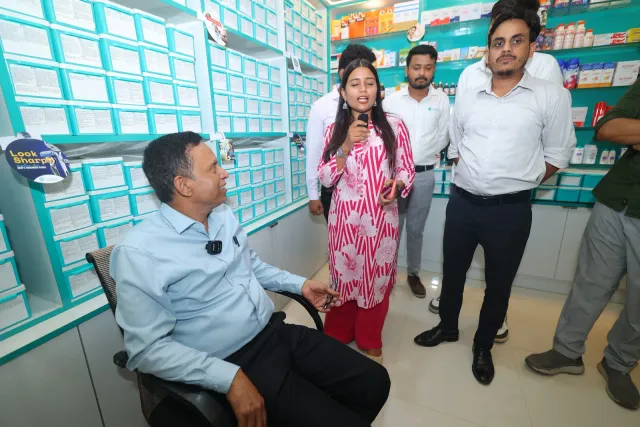 Guests share a conversation inside the decorated store. — Kahalgaon, Bhagalpur