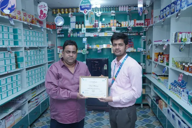 A certificate presentation celebrates a new chapter. — Parsagarh Bazar