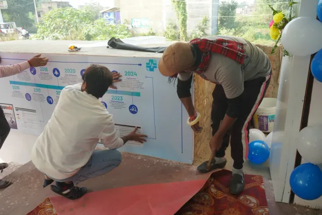 Rolling out the carpet captures the work that goes into welcoming guests. — Parsagarh Bazar