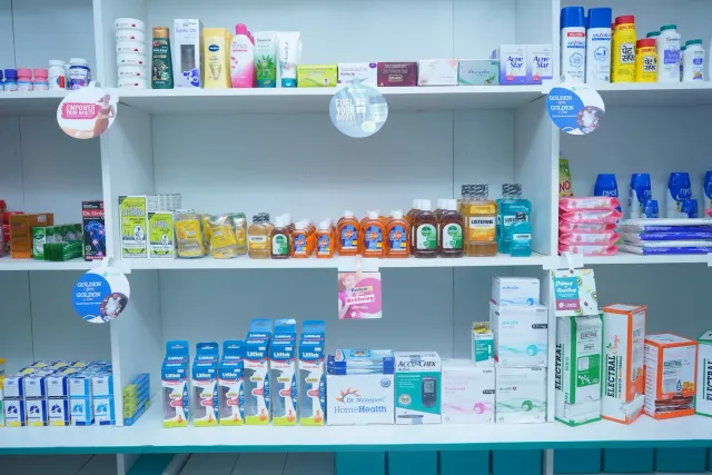 Neatly arranged shelves show a closer view of the pharmacy interior. — Parsagarh Bazar