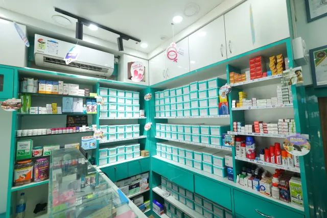 A bright interior pairs aqua storage with neatly arranged shelves. — Bartand, Dhanbad