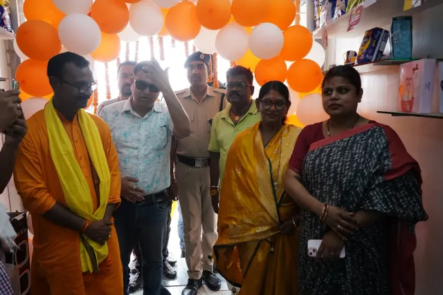 Guests come together beneath the opening-day balloon decorations. — Godhna Road