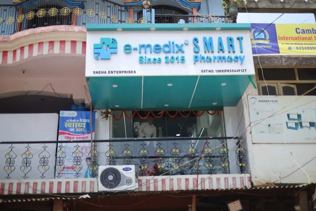 Aqua signage welcomes visitors to the pharmacy. — Simrahi Bazar