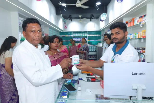 A welcoming exchange at the pharmacy counter. — Simrahi Bazar
