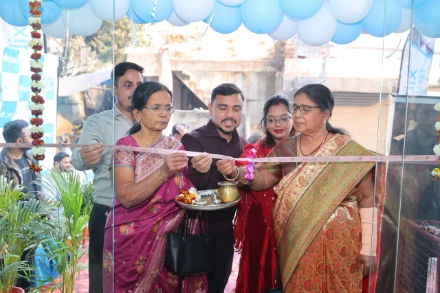 Guests celebrate together around the opening ribbon. — Sakchi, Jamshedpur