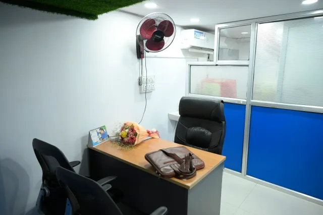 A closer look at the desk and seating area inside the store. — Bariatu