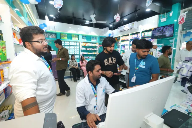 A candid view of people working around the pharmacy computers. — Malahi Pakri, Patna