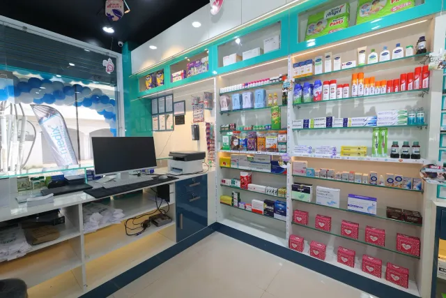 A glimpse of the computer station and workspace behind the counter. — Malahi Pakri, Patna