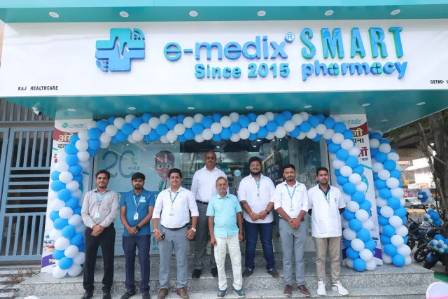 The team stands together beneath the opening-day balloon arch. — Malahi Pakri, Patna