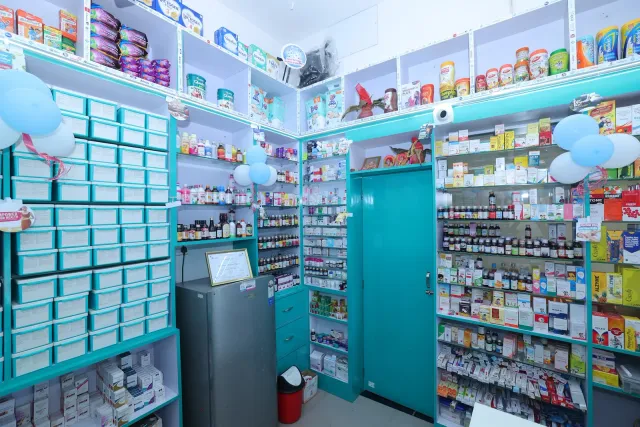 A wide view of the pharmacy's storage drawers and shelves. — Gomia