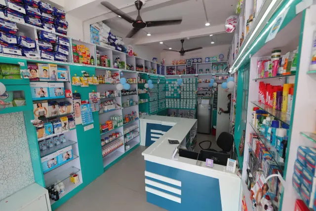 A bright aisle offers a view through the pharmacy interior. — Gomia