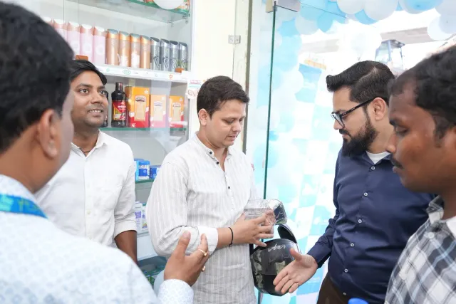 A candid discussion captures people coordinating around the store. — Changar More Bypass