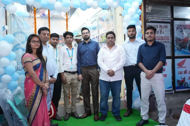 Guests stand together beneath the balloon-framed entrance. — Changar More Bypass