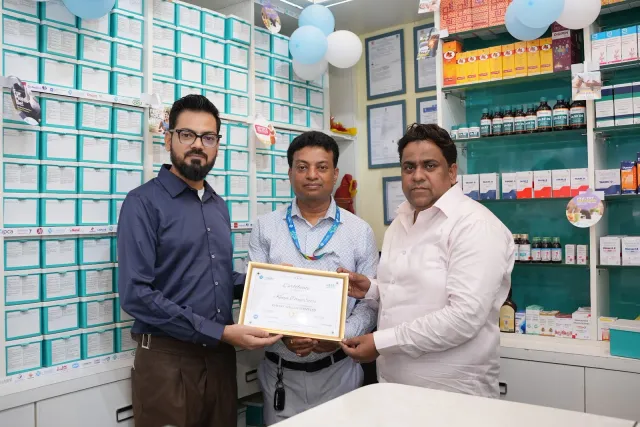 A certificate presentation marks the pharmacy's new chapter. — Changar More Bypass