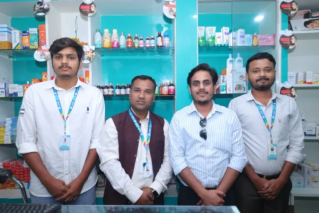 The pharmacy team gathers for an opening-day portrait. — Jamalpur, Munger