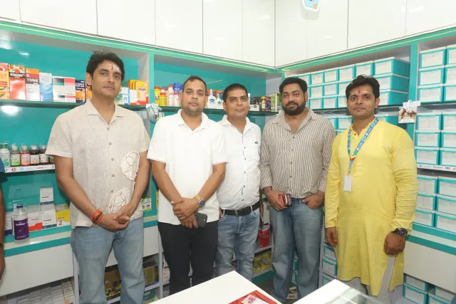 Guests and team members come together for a photograph inside. — Motipur, Muzaffarpur