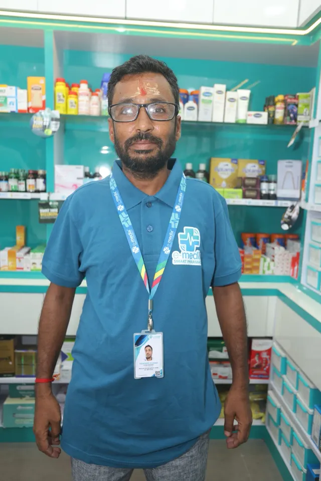 A team portrait captures another face behind the pharmacy. — Motipur, Muzaffarpur