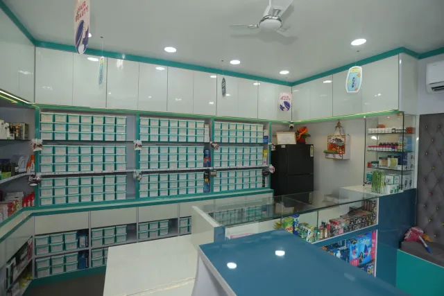 A bright pharmacy interior with organised aqua drawers and counters. — Motipur, Muzaffarpur