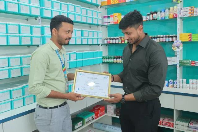 A certificate presentation celebrates the store's opening. — Kotwali Chowk, Bettiah
