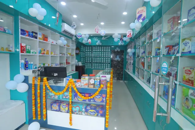 Floral decorations brighten a view through the pharmacy interior. — Mubarakpur, Danapur