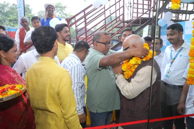 A floral greeting welcomes guests at the opening ribbon. — Mubarakpur, Danapur