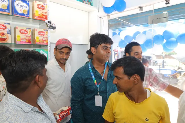 An unposed conversation captures the bustle around the counter. — Tribhuvan More