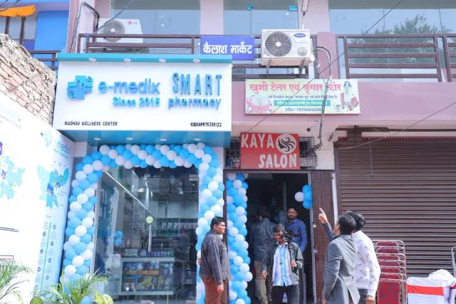 A blue-and-white balloon arch welcomes the neighbourhood. — Gardanibagh