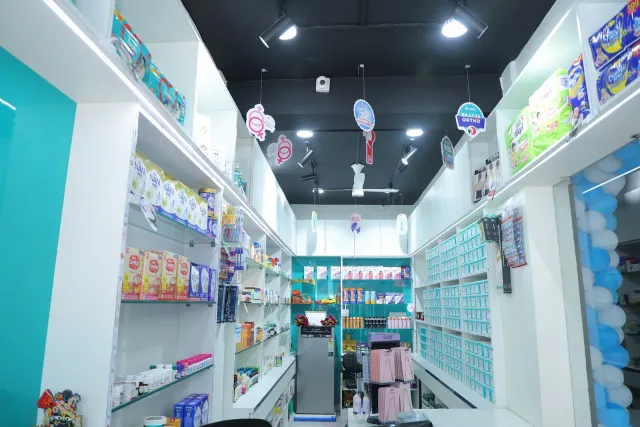 An organised aisle gives a clear view inside the pharmacy. — Gardanibagh