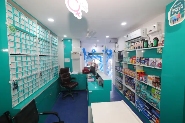 A view along the pharmacy's shelving and storage aisle. — Ashiana Nagar