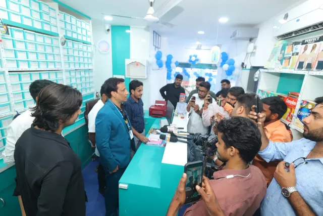 Guests fill the pharmacy with opening-day conversations. — Ashiana Nagar