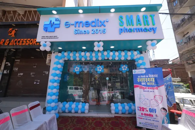 Blue-and-white balloons brighten the Kankarbagh storefront. — Housing Colony Kankarbagh