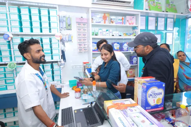 A candid view of the team checking items with visitors. — Housing Colony Kankarbagh