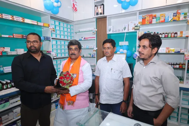 A bouquet presentation welcomes guests to the pharmacy. — Housing Colony Kankarbagh