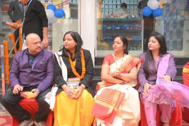 Guests pause together outside between opening-day activities. — Ramdayalu