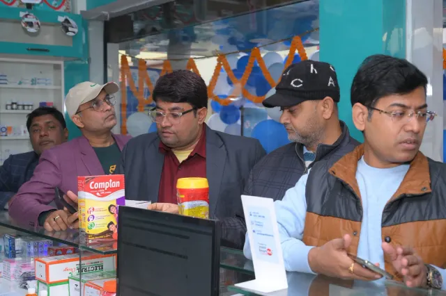 A closer look at people working around the pharmacy computer. — Ramdayalu