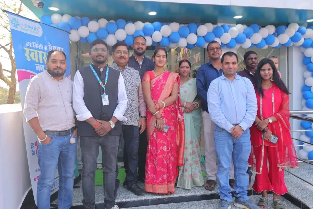 Guests gather beneath the balloons for a photograph outside. — Sirsiya, Giridih