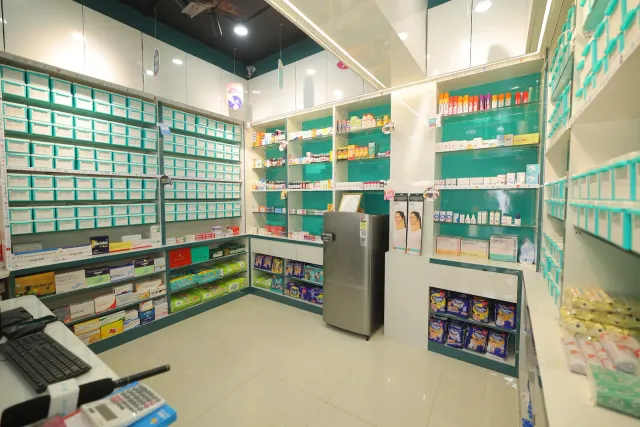 A closer look at the counter, laptop and working area inside the store. — Sirsiya, Giridih