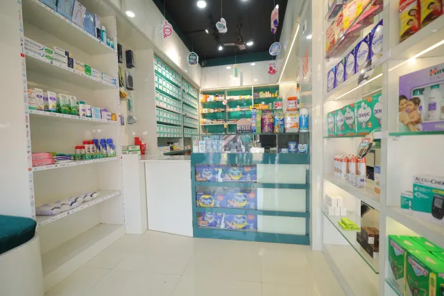 A bright aisle leads through the store's organised shelves. — Sirsiya, Giridih