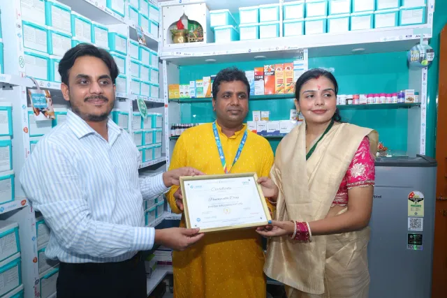 A certificate presentation celebrates a new chapter for the store. — Supriya Cinema Chowk