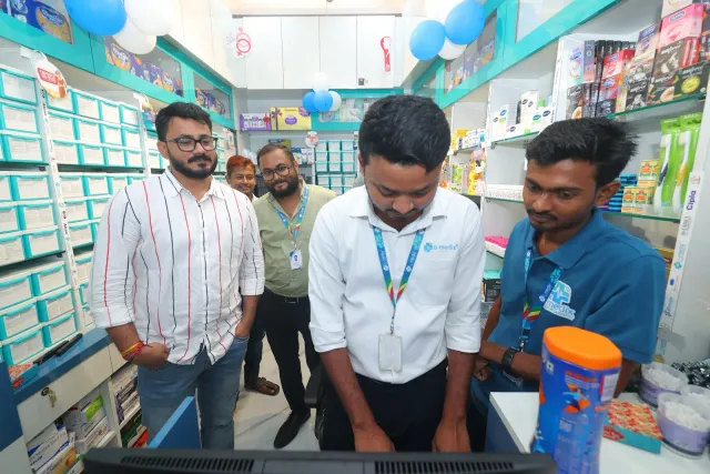 Team members look over items together at the pharmacy counter. — Arya Samaj Road, Samastipur
