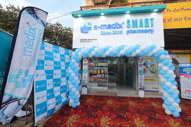 A blue-and-white balloon arch sets the scene for the opening. — Bhurbhura More, Deoghar